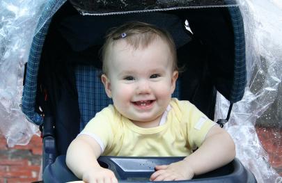 It was raining, and Audrey didn't like her plastic covering, hence she got wet.  But look at her cute little curls!