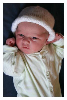 Eyes, like most newborns, are blue, but his are dark blue gray steel cool blue.
