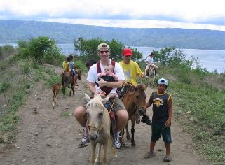 After the boat ride, you take horses to the rim of the inner volcano.  The horses are not meant for Americans...  Laura's guide was the coolest.  He sang to her the whole way down.
