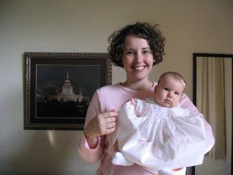Laura holding Audrey.  Audrey likes to grab things now.  Like her dress.  That's why it looks like she is curtsy-ing.